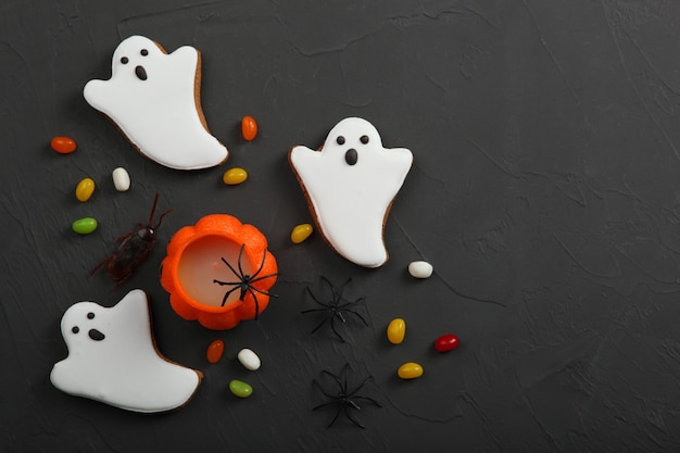 Halloween background with gingerbread and other sweets with place for text