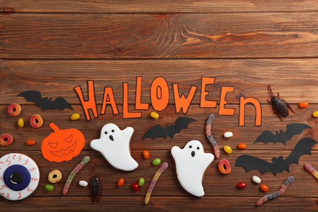 Halloween background with gingerbread and other sweets with place for text