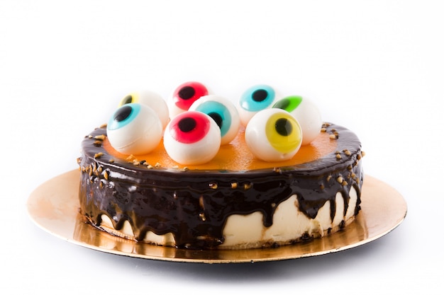 Premium Photo | Halloween cake with candy eyes decoration isolated