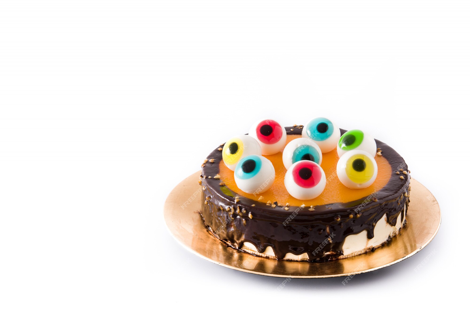 Premium Photo | Halloween cake with candy eyes decoration isolated