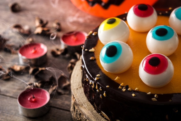 Premium Photo | Halloween cake with candy eyes decoration