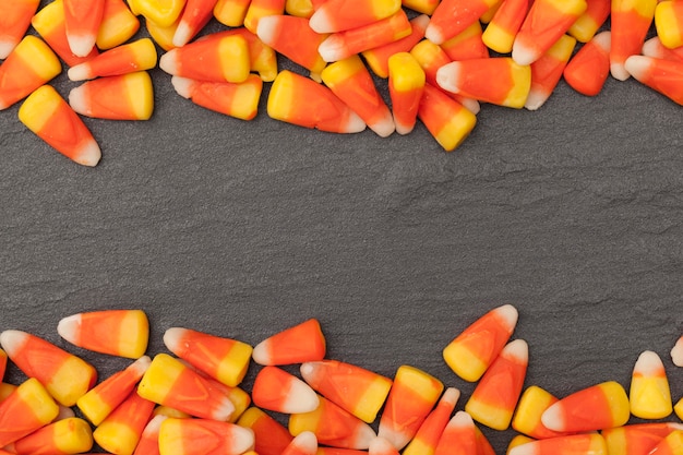 Halloween candy corn sweets on a slate background