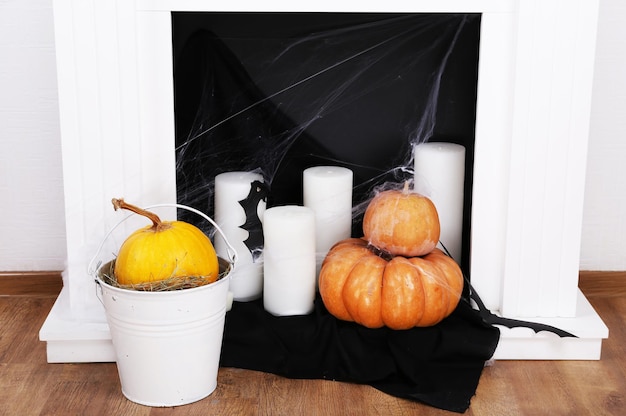 Photo halloween composition on fireplace in room