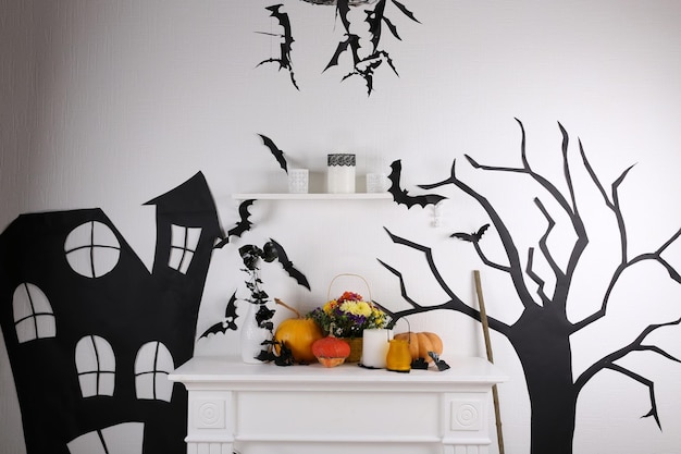 Photo halloween composition on fireplace in room