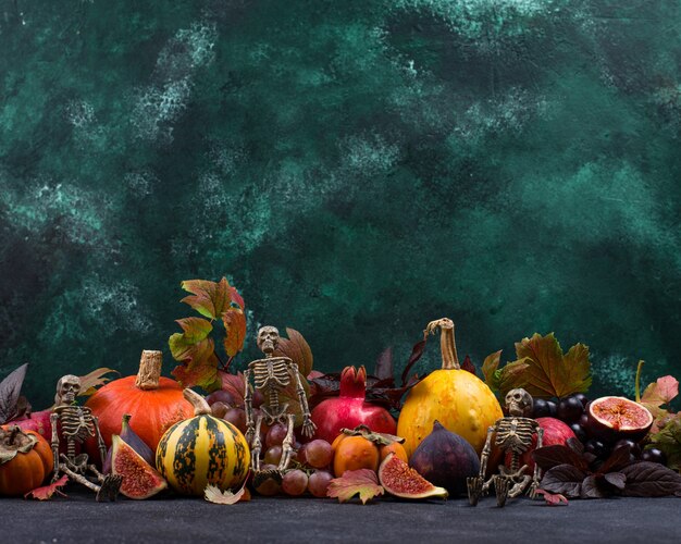 Halloween composition with autumn fruits