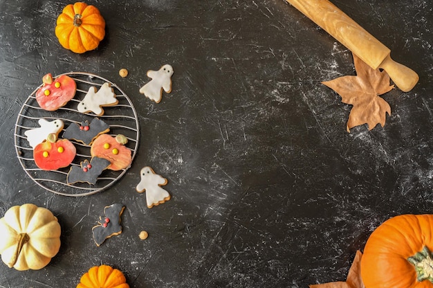 Halloween cookies on the black background with copy space