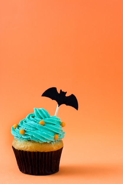 Halloween cupcake on orange