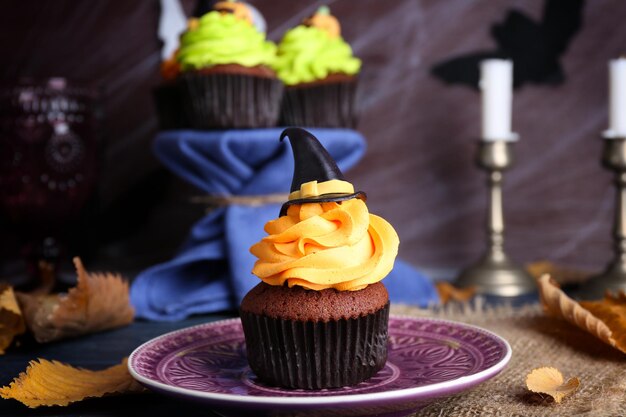 Halloween cupcake on plate on the table