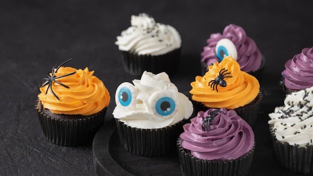 Halloween cupcakes with buttercream and holiday decoration. Halloween muffin Halloween creative food