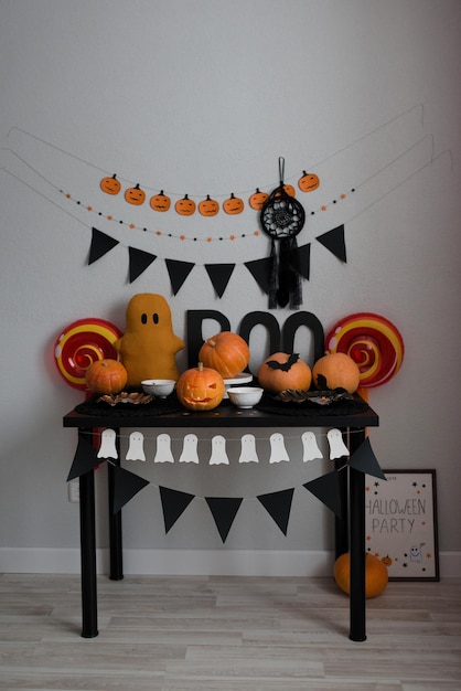 Premium Photo | Halloween decor celebrating at home table with ...