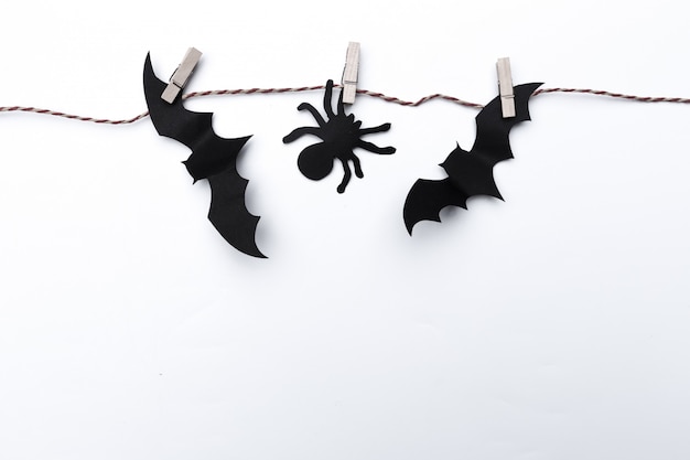 Halloween and decoration concept - paper bats flying