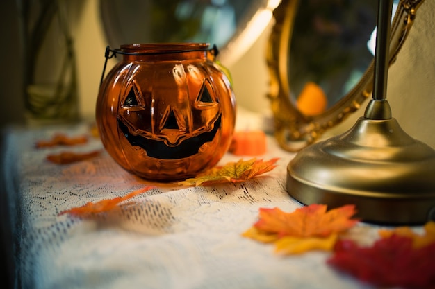 Halloween decorations background Halloween Scary pumpkin head on wooden table Halloween holiday concept