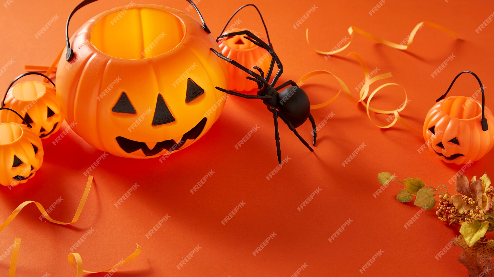 Premium Photo | Halloween decorations on orange background