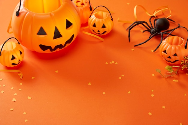 Halloween decorations on orange background