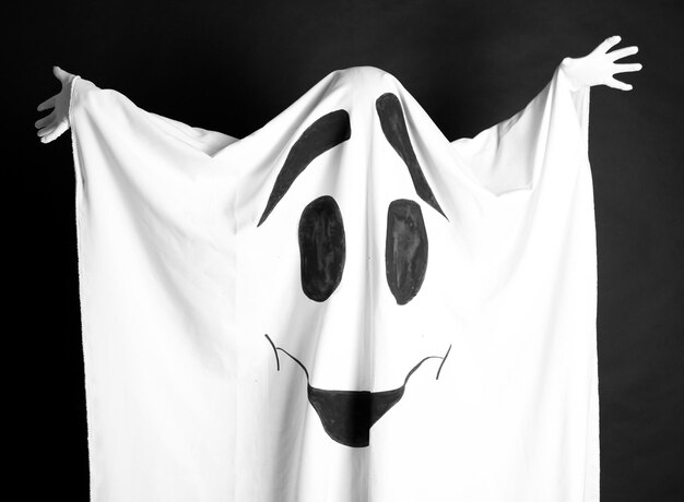 Premium Photo | Halloween ghost on dark background