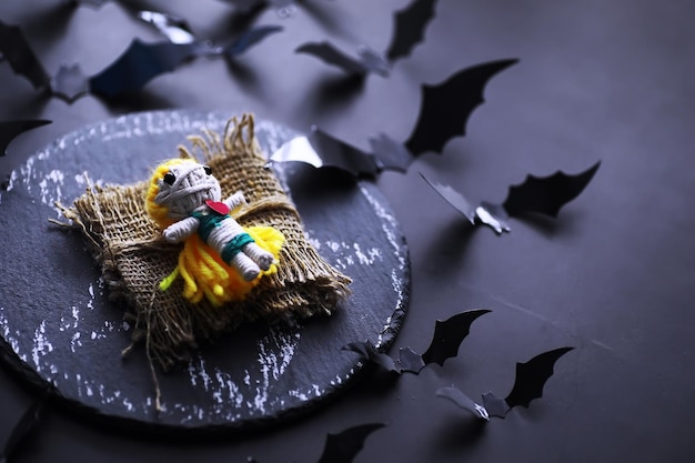 Halloween holiday concept Old stone table in a shape of bats Halloween paper