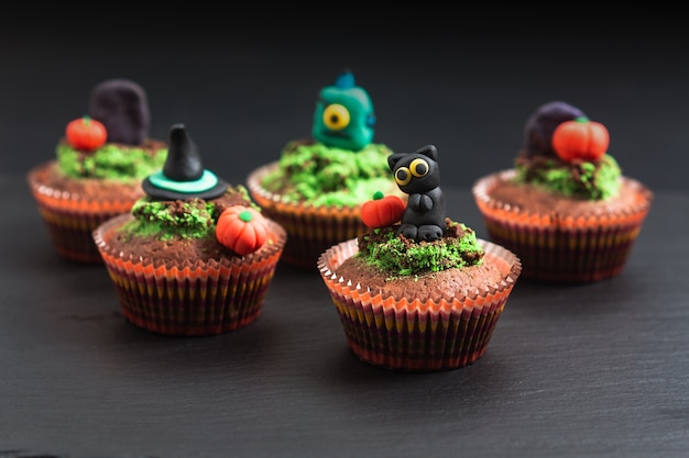 Halloween Holiday food colorful fancy brownies cupcake with fondant decorate 