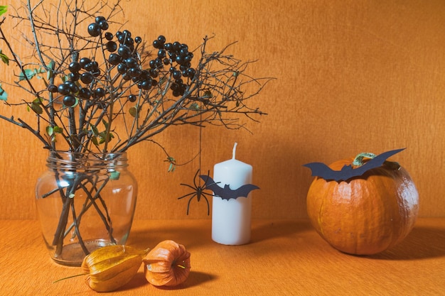 Halloween home decorations on orange background Still life Shallow depth of field Toned