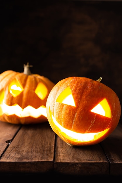 Halloween lightning pumpkins for party on a wooden table