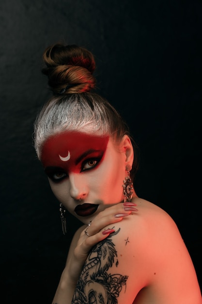 Halloween make up sugar skull beautiful model with perfect hairstyle. Santa Muerte concept. Fashion retro toning.