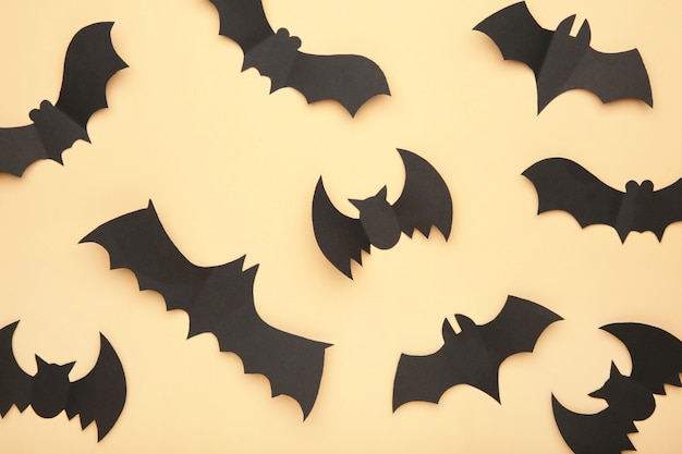 Halloween paper bats on biege background. Halloween concept.