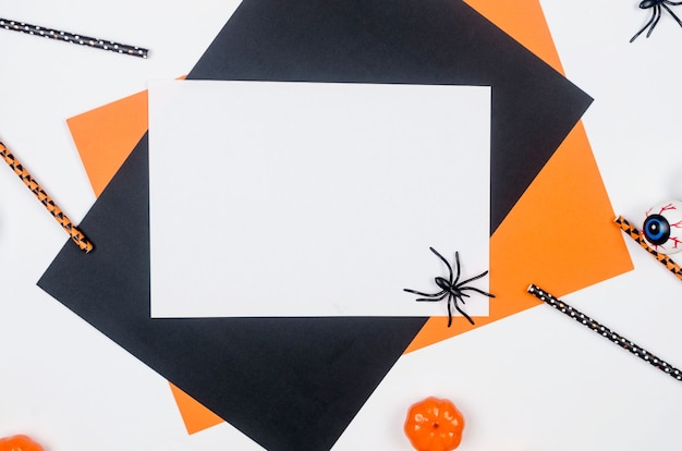 Photo halloween party composition on paper background in black, orange and white. , halloween party