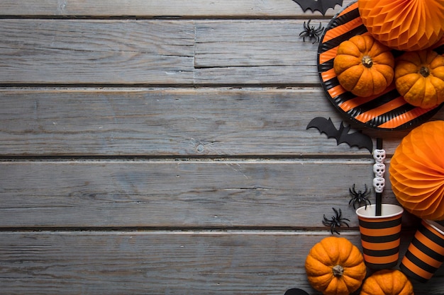 Halloween party decorations on a rustic wooden background