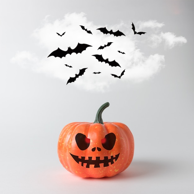 Halloween-pompoen met vleermuizen op een witte achtergrond