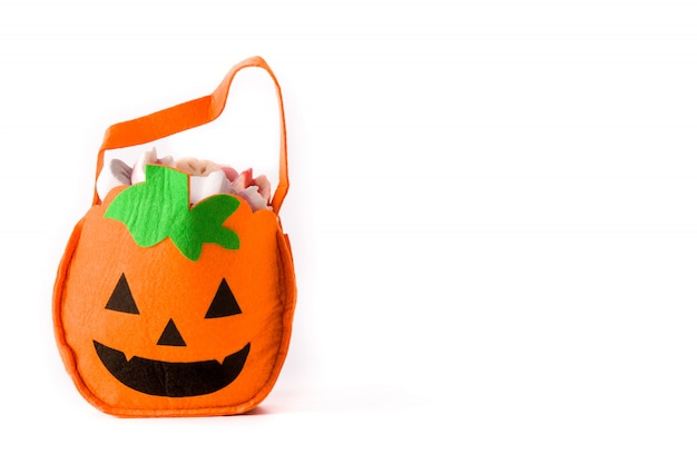 Photo halloween pumpkin bag with candies inside