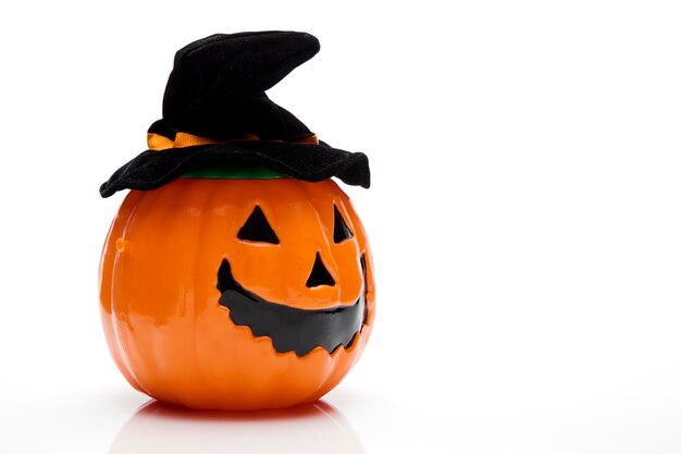 Halloween pumpkin in black hat