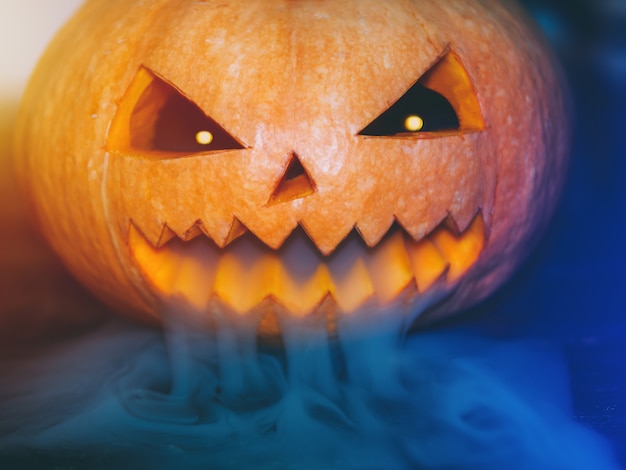 Halloween pumpkin on black wooden background