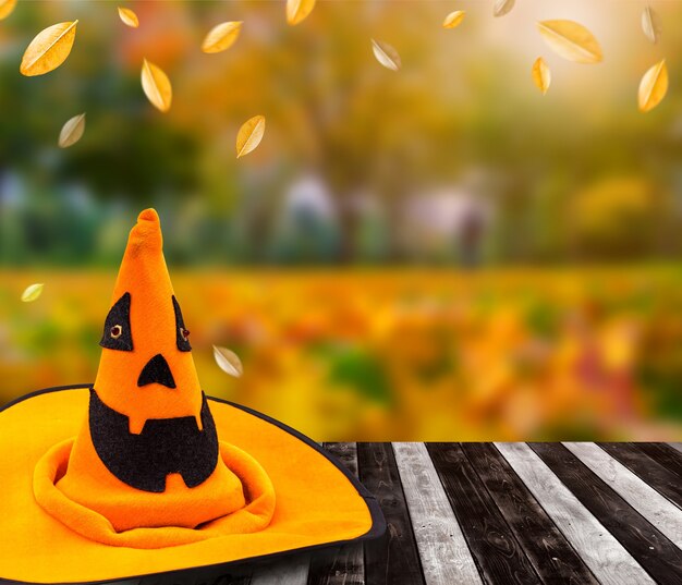 Photo halloween pumpkin face with autumn background