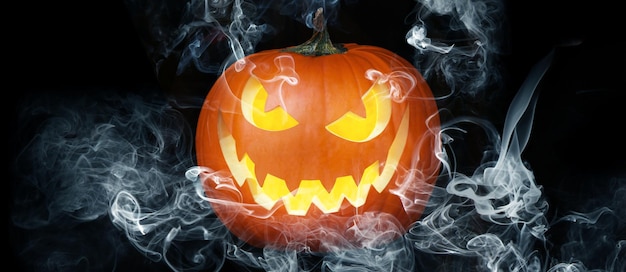 Halloween pumpkin face with burning fire inside