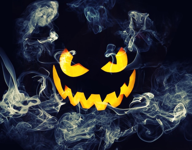 Halloween pumpkin face with burning fire inside