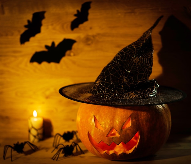 Halloween pumpkin head jack lantern on wooden background