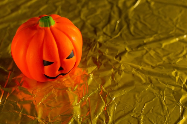 The halloween pumpkin jack in gold holiday background image