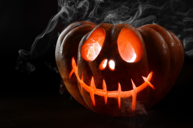 Halloween pumpkin on table on dark background