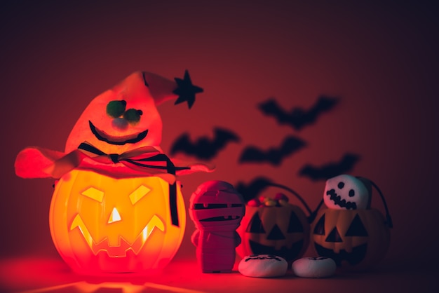 Halloween pumpkin with sweets candies and ghost marshmallow. 