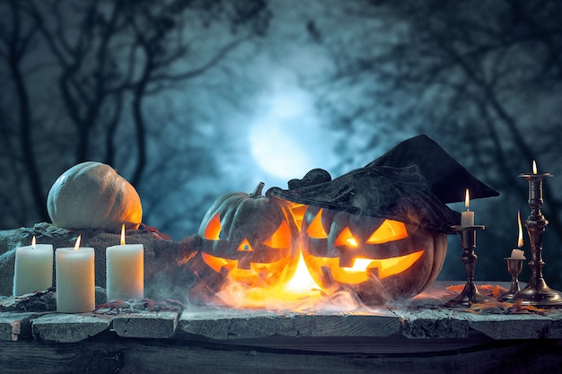 Halloween pumpkins on dark forest blue background