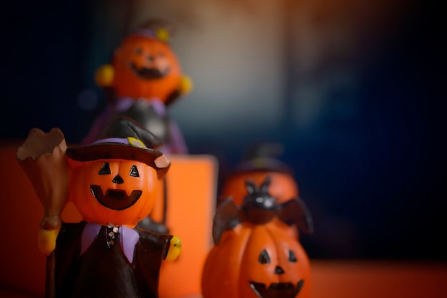 Halloween pumpkins jack-o-lantern on orange background.