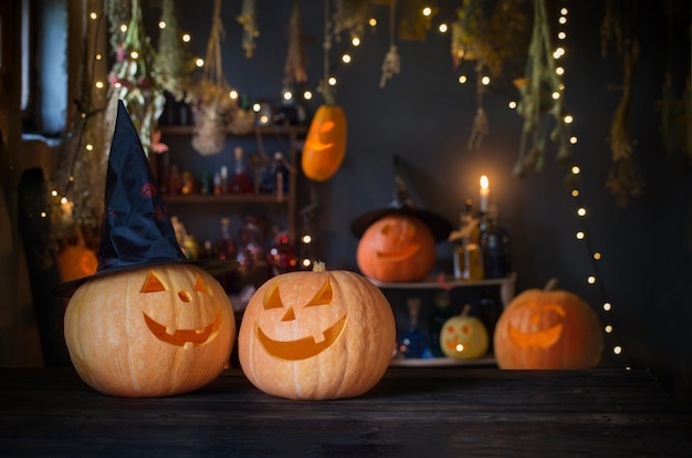 Halloween pumpkins on old wooden table on background Halloween decorations