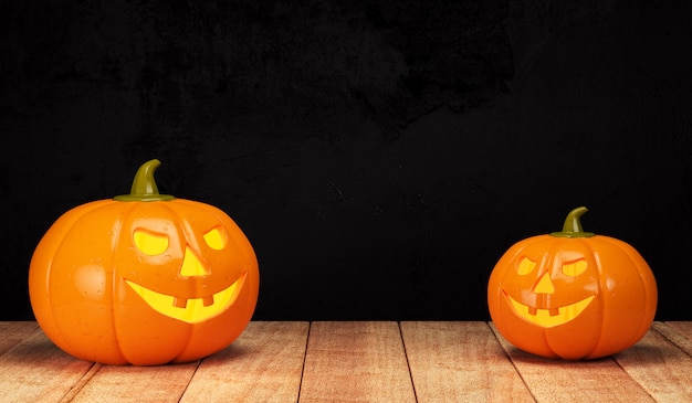 Halloween pumpkins on wooden surface