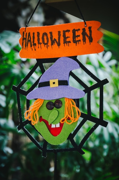 Halloween sign with witch and web