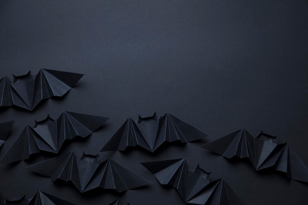 Halloween spooky dracula bats background made from origami