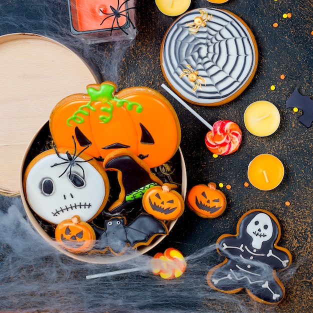 Halloween with gingerbread, pumpkins and candles