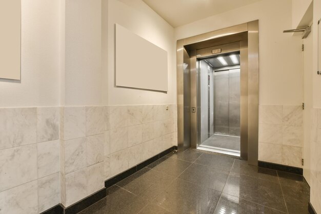 the hallway of a building with a white marble wall