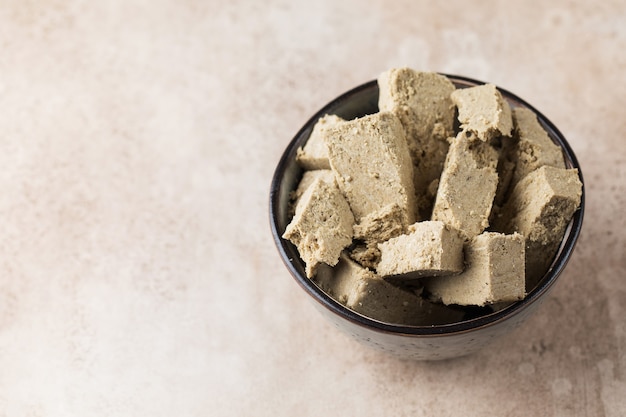 Halva slices in a bowl oriental sweetness copy space