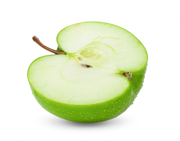 Halve groene appel op witte tafel.
