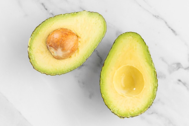 Halved avocado for healthy salad