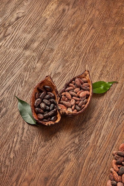 Halved cocoa pods with peeled and unpeeled beans